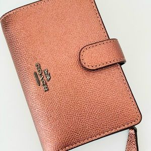 Coach Wallet with a snap and zipper, unique color.
